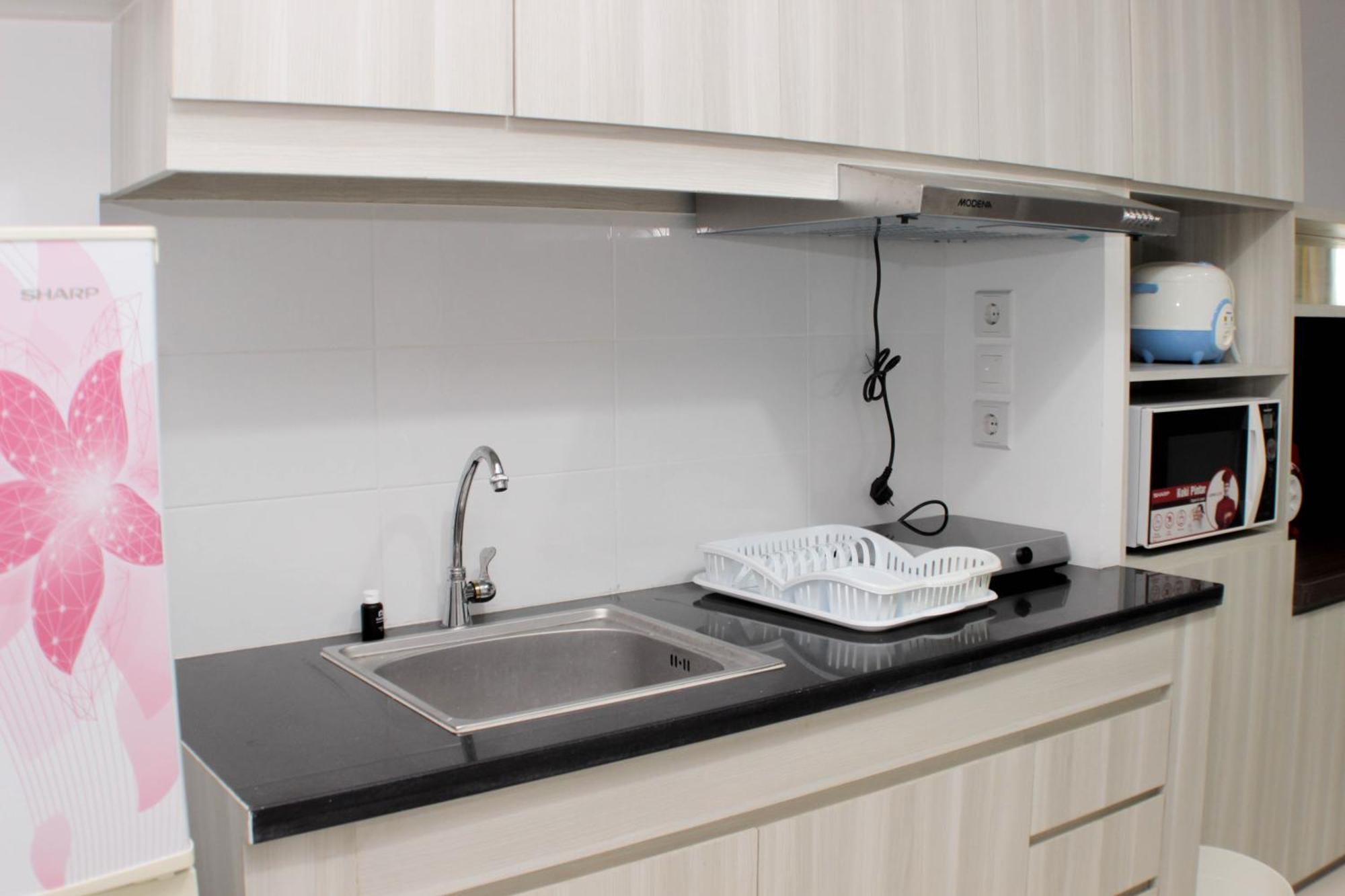 Comfort And Minimalist At Azalea By Travelio Apartemen